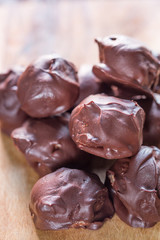 Raw Chocolate Truffles on Dark Wooden Background