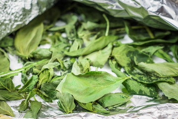 Basil leaves frozen in foil