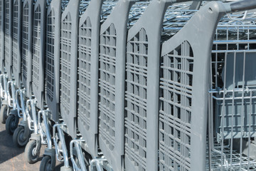 Wire modern supermarket shopping cart, symbol of consumerism