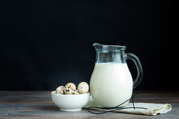 Concept of natural healthy organic food, Jug of milk and quail e