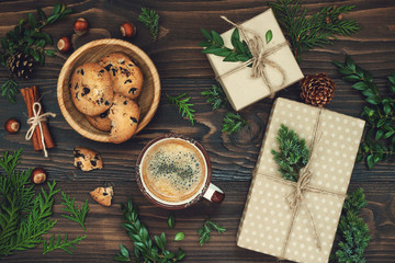 Decorated gift boxes, presents on rustic wooden table. Ideal Christmas morning breakfast. Overhead, flat lay, top view