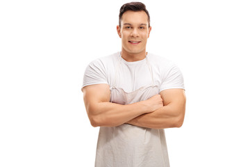 Young butcher posing with his arms crossed