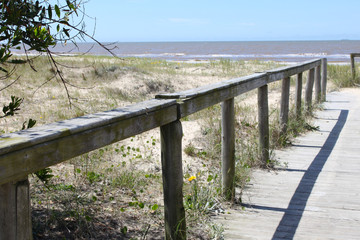 Wooden bridge to the beach