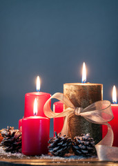 Christmas candles with christmas decorations, christmas or new year atmosphere, vertical with place for text