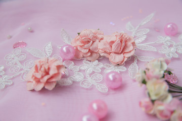 Fototapeta na wymiar pink flowers and beads.