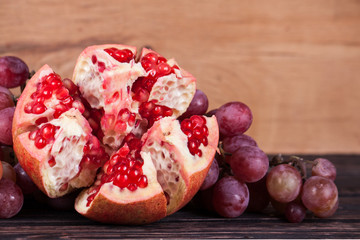 Ripe red grapes and pomegranate