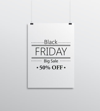 paper card with black friday on white wall
