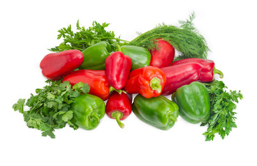 Green and red bell peppers and bundles of greens