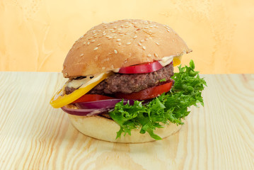 Traditional hamburger on a wooden surface