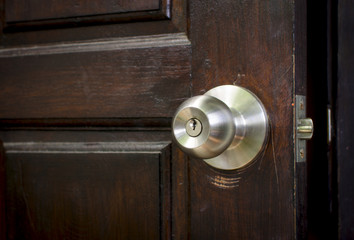 metal handle or doorknob on wooden door