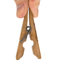 hand holds the clothespin