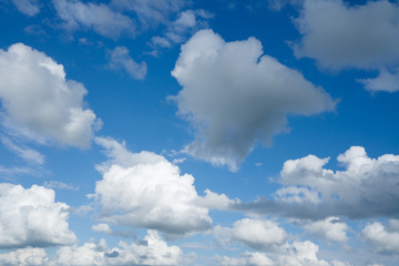 Naklejka na ściany i meble Clouds flying against blue sky.