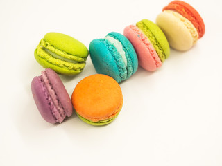 Colorful macaron cookies on white background, select and soft focus