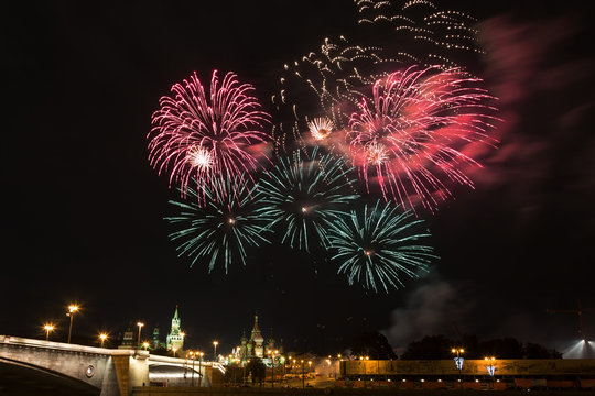 Fireworks over the Moscow Kremlin at night. View of the Moscow River, Russia