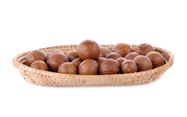 macadamia nuts in basket isolated on white background