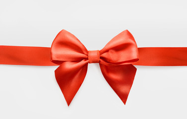 red satin bow on white background, whole object is cut with clipping path