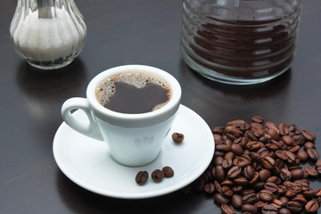 pile of coffee beans and a cup