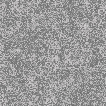Floral doodle seamless wallpaper pattern. Illustration with paisley ornaments. Textile with hand-drawn flowers.
