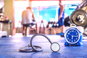 stethoscope on floor gym with blur background 
