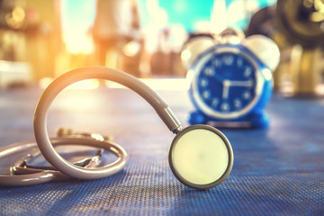 stethoscope on floor gym with blur background 