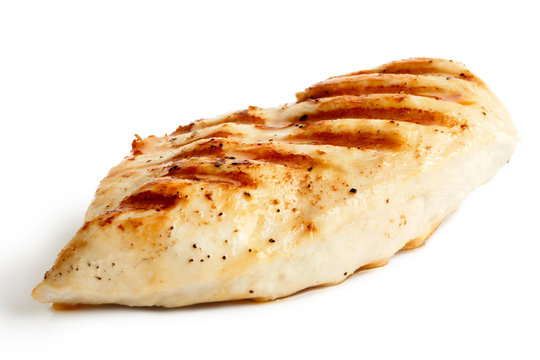  Whole grilled chicken breast with black pepper isolated on white.