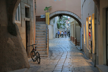 bicycle by arched narrow street
