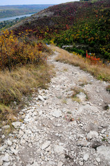 Colors of the autumn. Gorgeous walk in the park on mountain stony road. Ancient monastery - Village Saharna.