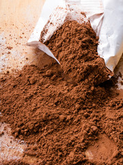 cocoa powder on wooden background