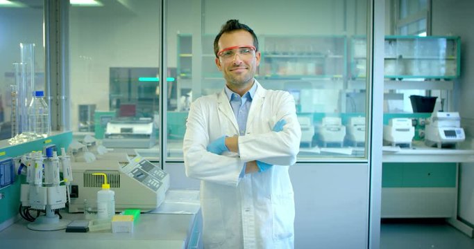 young and charming doctorlook in the camera and smile in the laboratory researcher with professional development material