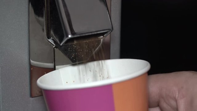 ground coffee from the grinder poured in a cardboard Cup