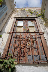 old wood door w rusted gate upview