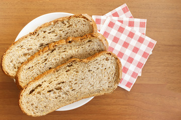 Black bread on table with red napkins