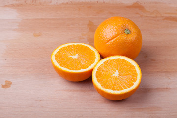 Half cut Orange on wooden table