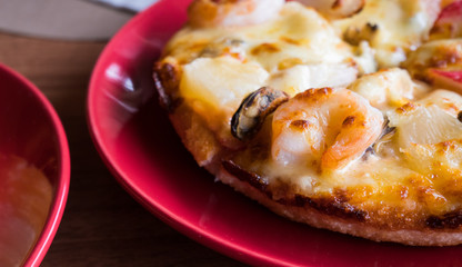 Still-life seafood pizza at italian restaurant.