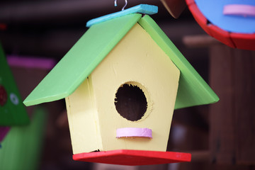 colorful bird house as background.