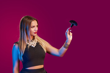 Woman makeup artist standing with brush