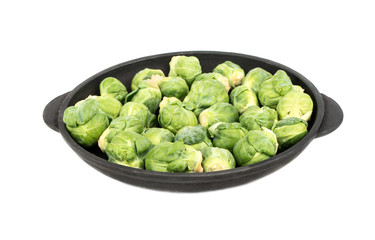 Raw brussels sprouts in pan