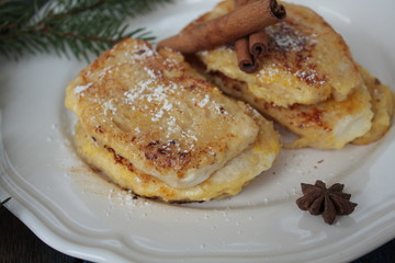  French toast with cinnamon on wooden background