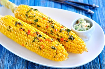 Corn baked in foil with butter, garlic, chili, coriander and sea salt.