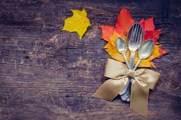 Naklejka na ściany i meble Thanksgiving autumn place setting with cutlery