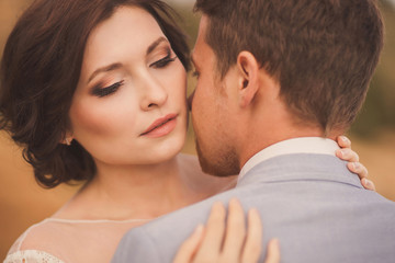 Closeup portrait of a romantic and stylish caucasian couple hugging. Love, relationships, romance, happiness concept.