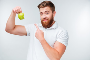 Portrait of a handsome man showing biceps