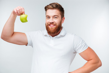 Portrait of a handsome man showing biceps