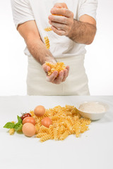 The Cook Prepares the Pasta / Cook in white coats preparing the sauce for Italian pasta.