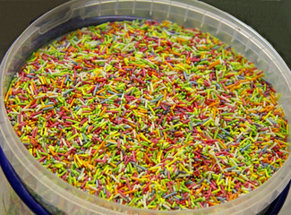 A Tub of Coloured Confectionery Sweet Sugar Sprinkles.