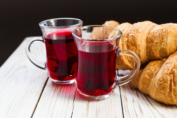 Fresh Croissants and cups of hot hibiscus tea