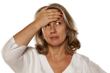 Portrait of beautiful middle-aged woman who remembered something