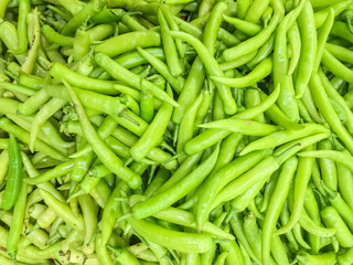 Closeup surface pile of green pepper , bell pepper or sweet pepper textured background