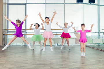 Fototapeta na wymiar happy children dancing on in hall, healthy life, kid's togethern