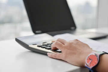 Fototapeta premium Business woman is using the calculator
